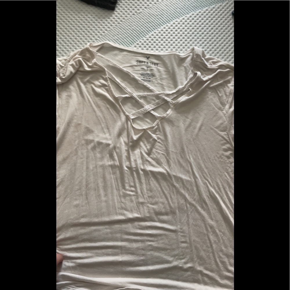 Off white criss cross womens t-shirt. Fits rather bigger but super breathable .
